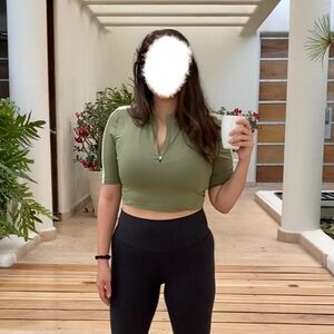Green fitted cropped quarter zip short sleeve top